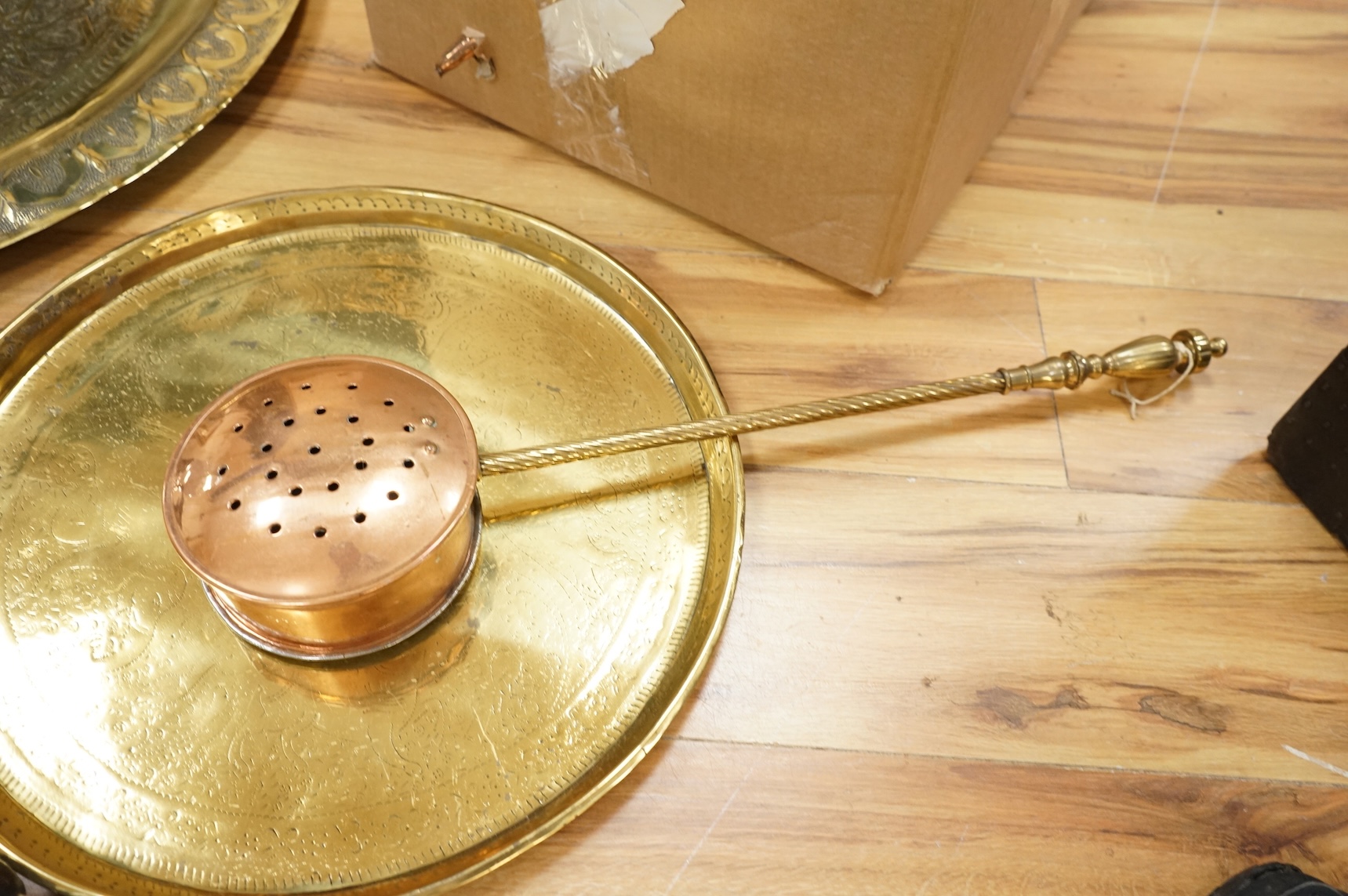 A group of metalware to include brass trays and copper warming pans
